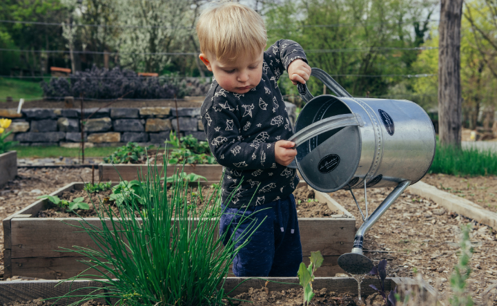 boy using watering can